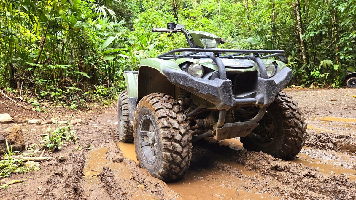 Four wheeler in the mud in a rainforest